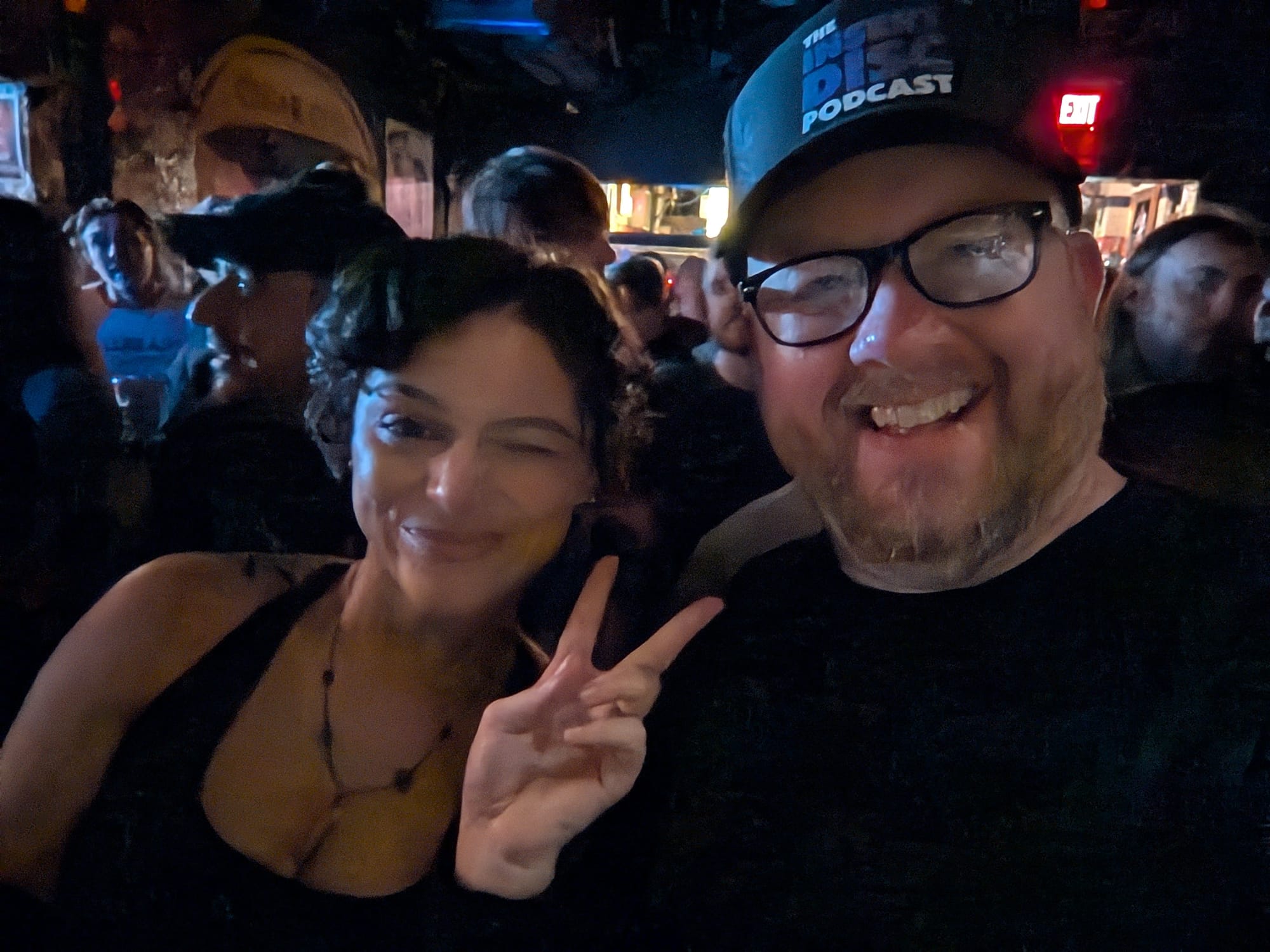 A selfie of myself and my daughter, whom is winking and throwing a peace sign.