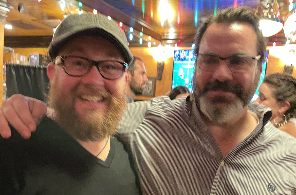 Two very handsome young, bearded men.